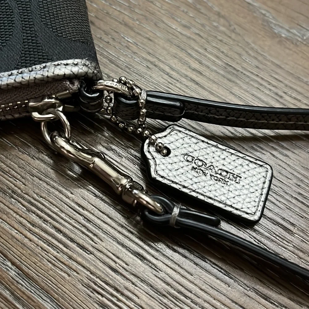 Coach black signature silver metallic leather edge wristlet